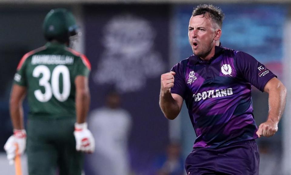 Scotland’s Chris Greaves celebrates after taking the wicket of Bangladesh’s Mushfiqur Rahim in the Scots’ surprising T20 World Cup win on Sunday.