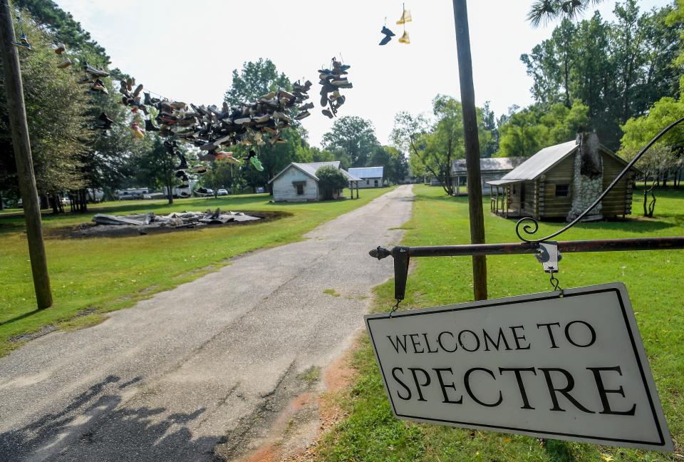 One of the remaining movie prop houses from the Town of Spectre scenes in the film Big Fish burned after being struck by lightning on Jackson Island in Millbrook, Ala., as seen on Monday July 3, 2023.