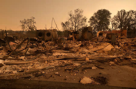 A burned out home in the small community of Keswick is shown from wildfire damage near Redding, California, U.S., July 27, 2018. REUTERS/Alexandria Sage