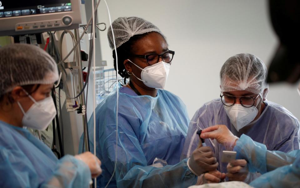 Paris hospitals have been told to cut 40 per cent of non-essential operations to free up beds for Covid patients - Benoit Tessier/Reuters