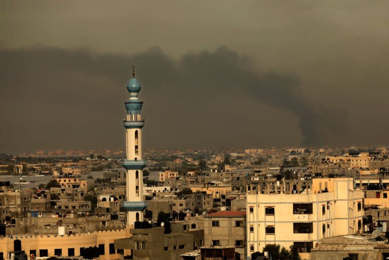A picture taken from Rafah shows smoke billowing over Khan Yunis in the southern Gaza Strip, during an Israeli strike, on Sunday, December 10, 2023. Photo by Ismael Mohamad/UPI.