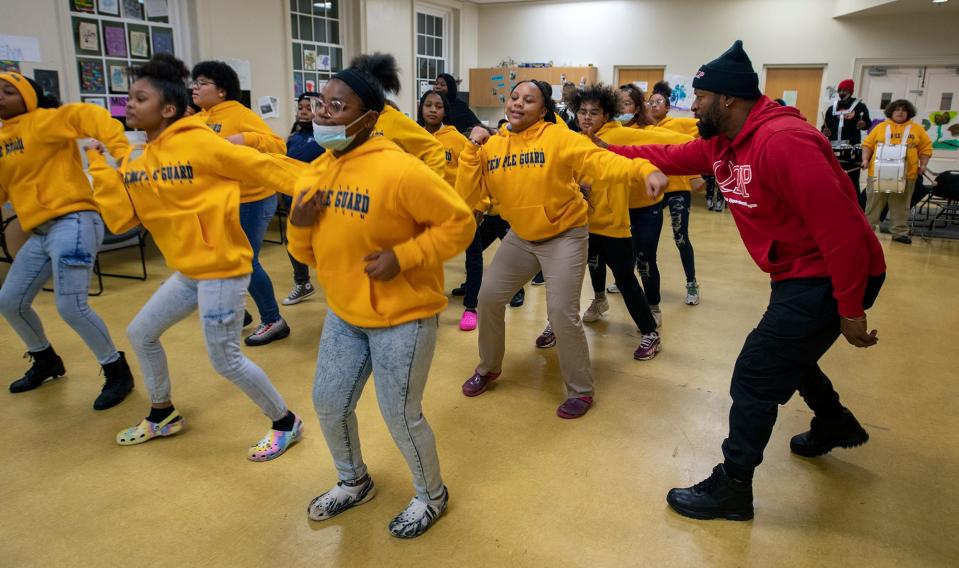 Mike Smith, right, works with a group of recruits. Over the two years of the pandemic, students transitioned out to college and ranks weren't filled as quickly as in the past resulting in a mostly all new group as in-person events opened back up.