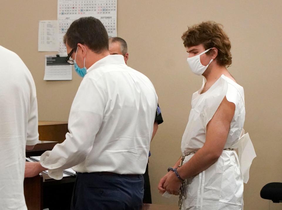 Payton Gendron talks with his attorney during his arraignment in Buffalo City Court, Saturday, May 14, 2022, in Buffalo, N.Y. Gendron was arraigned on first-degree murder charges and ordered detained without bail. Police officials said the 18-year-old was wearing body armor and military-style clothing when he pulled up and opened fire at people at a Tops Friendly Market.