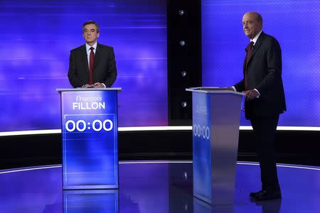 French politicians Alain Juppe (R) and Francois Fillon attend the third prime-time televised debate as they campaign in the second round for the French center-right presidential primary election in Paris, France, November 24, 2016. REUTERS/Eric Feferberg/Pool