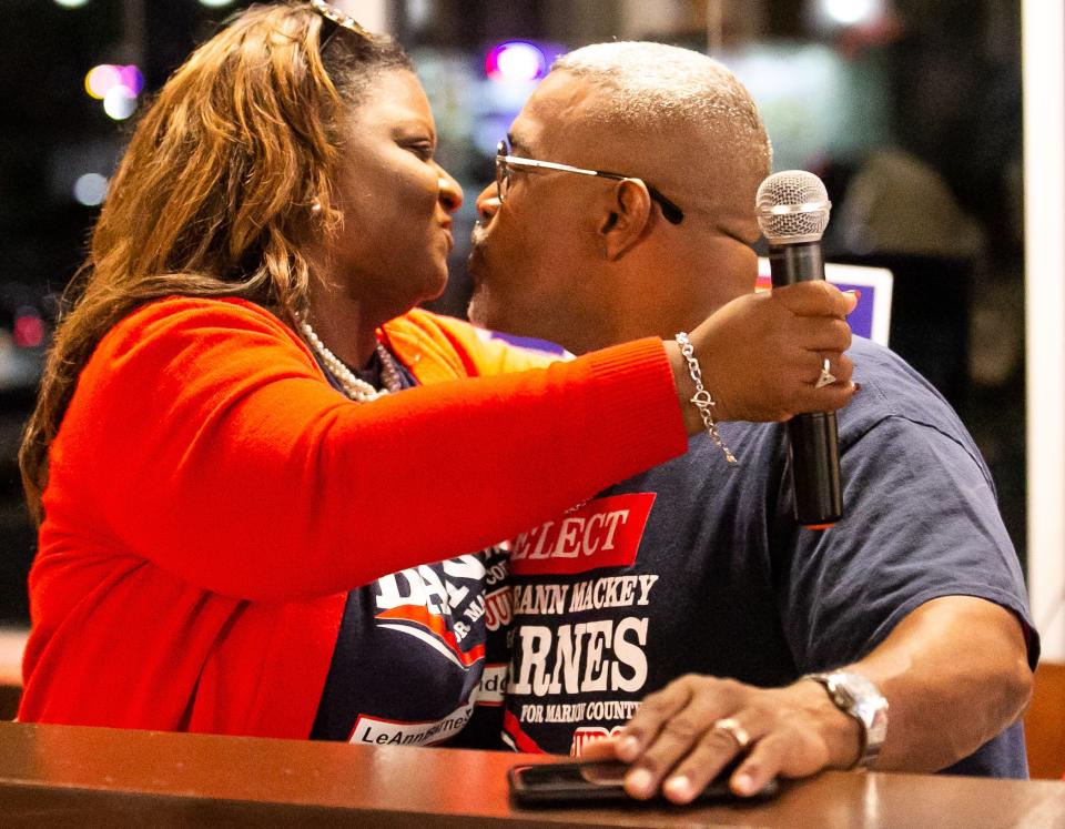 LeAnn Barnes gets a kiss from her husband, Troy Barnes, during the campaign watch party Tuesday.