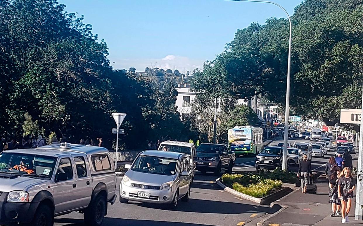 Traffic slowly works up to high ground at Whangarei, New Zealand, after a tsunami warning is issued