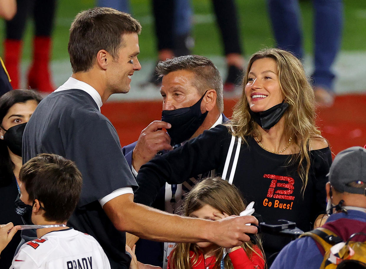 TAMPA, FLORIDA - FEBRUARY 07: Tom Brady #12 of the Tampa Bay Buccaneers celebrates with Gisele Bundchen after winning Super Bowl LV at Raymond James Stadium on February 07, 2021 in Tampa, Florida. (Photo by Kevin C. Cox/Getty Images)
