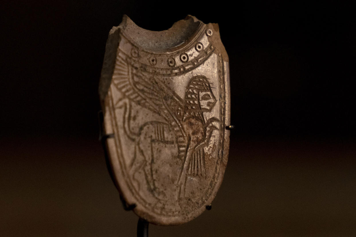 A 2,700-year-old ivory incense spoon plundered from a site in the occupied West Bank — seized in late 2021 by the Manhattan District Attorney's office as part of a plea deal with billionaire hedge fund manager Michael Steinhardt, displayed at the Palestinian Ministry of Tourism and Antiquities in the West Bank city of Bethlehem, Thursday, Jan. 19, 2023. Earlier this month, American officials handed over the artifact to the Palestinians in what the U.S. State Department's Office of Palestinian Affairs said was "the first event event of such repatriation" by the U.S. to the Palestinians. (AP Photo/ Maya Alleruzzo)