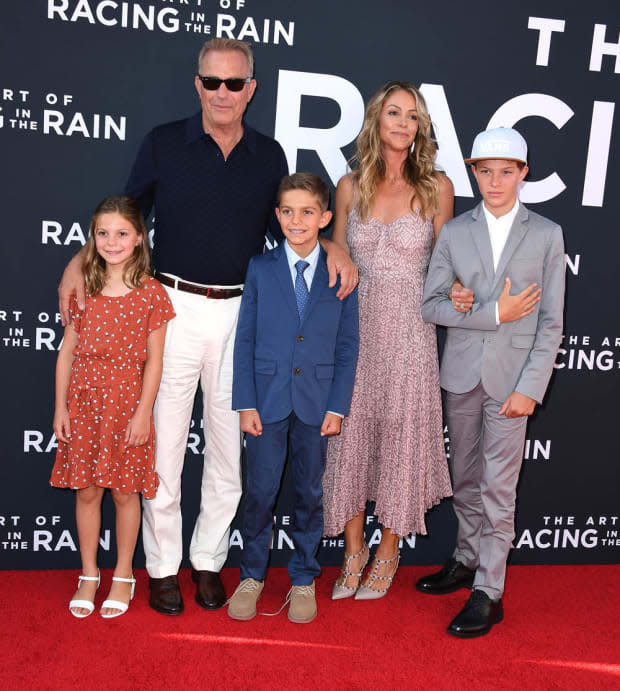 <p>Kevin Costner, wife Christine Baumgartner and their children Grace, Hayes and Cayden arrive at the premiere of <em>The Art Of Racing In The Rain</em>"at El Capitan Theatre in Los Angeles, California. </p>