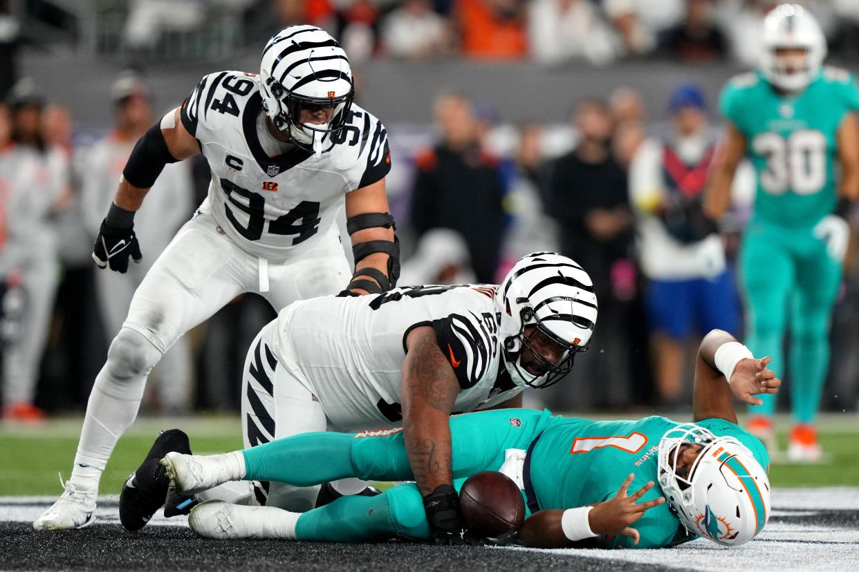 Sep 29, 2022; Cincinnati, Ohio, USA; Cincinnati Bengals defensive tackle Josh Tupou (68) sacks Miami Dolphins quarterback Tua Tagovailoa (1) in the second quarter during a Week 4 NFL football game, Thursday, Sept. 29, 2022, at Paycor Stadium in Cincinnati. Mandatory Credit: Kareem Elgazzar-USA TODAY Sports