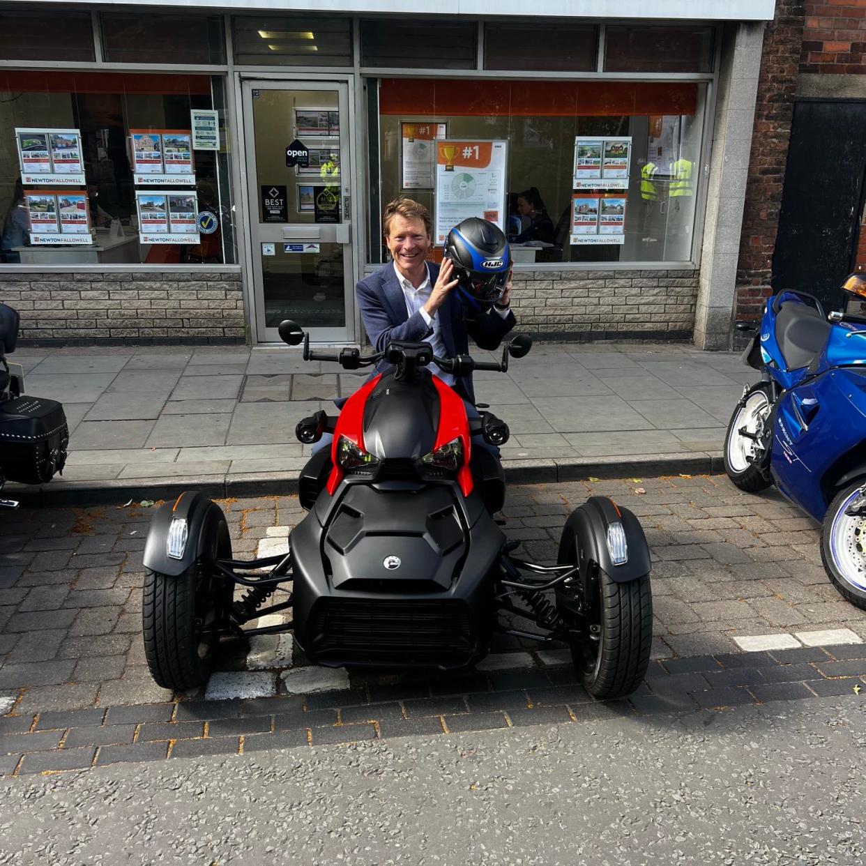 Richard Tice at the wheel of a trike motorcycle in Boston, Lincolnshire