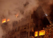 <p>A firefighter tries to extinguish a fire at a building in downtown Sao Paulo, Brazil May 1, 2018. (Photo: Leonardo Benassatto/Reuters) </p>