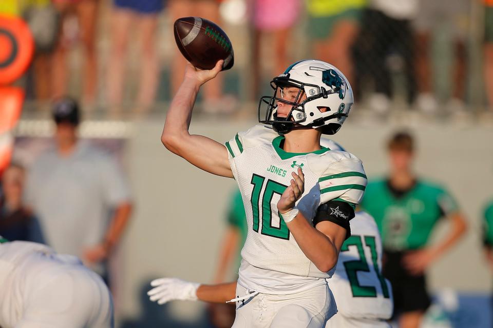 Clayton Creasey of Jones throws a pass during a high school football game between Bethany and Jones in Bethany, Okla., Wednesday, Aug. 24, 2022. 
