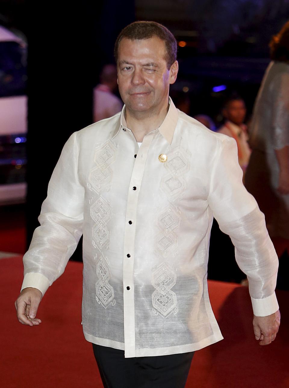 Russia's Prime Minister Dmitry Medvedev winks as he arrives for a welcome dinner during the Asia-Pacific Economic Cooperation (APEC) summit in the capital city of Manila