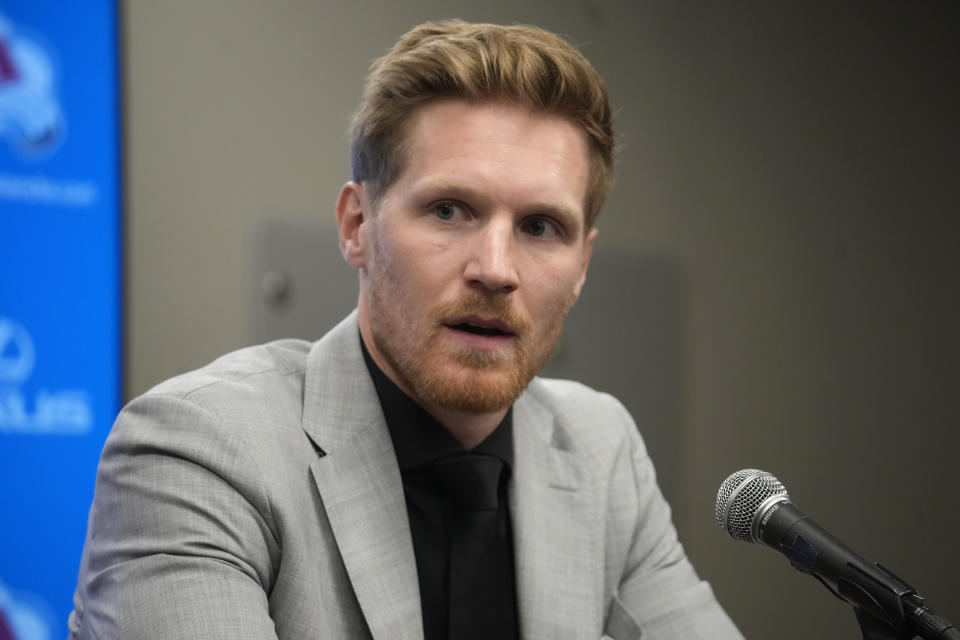 Injured Colorado Avalanche left wing and captain Gabtiel Landeskog talks during a news conference Thursday, April 13, 2023, in Denver. Landeskog announced that he will not play in the NHL hockey team's Stanley Cup Playoffs because of a lingering knee injury. (AP Photo/David Zalubowski