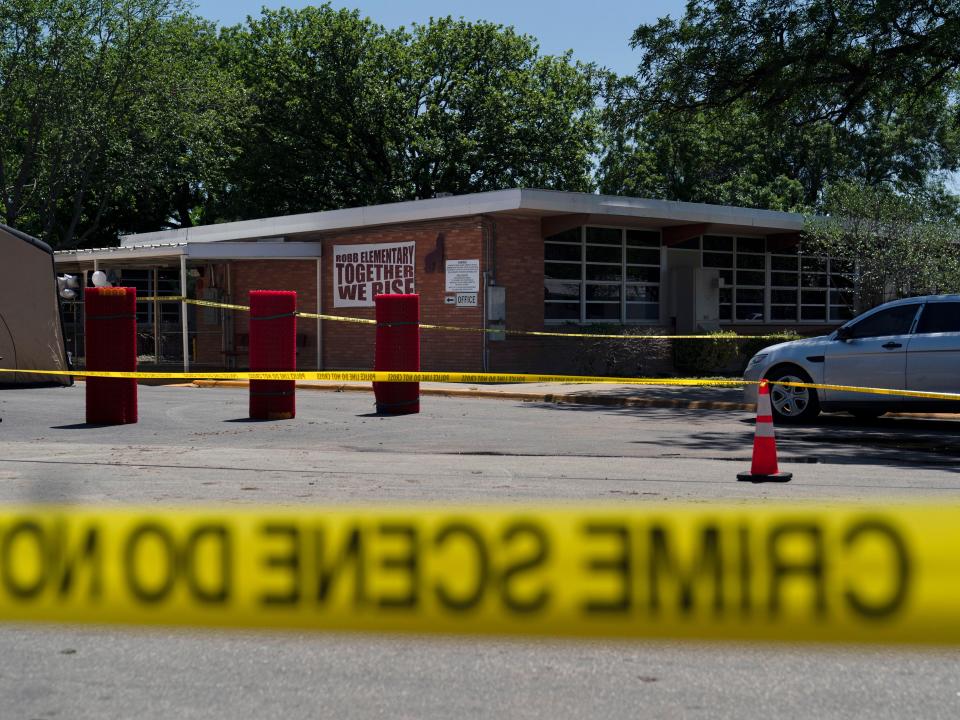 Crime scene tape surrounds Robb Elementary School in Uvalde, Texas, Wednesday, May 25, 2022.