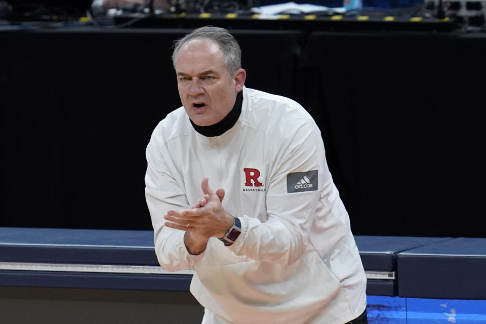 FILE - In this March 19, 2021, file photo, Rutgers head coach Steve Pikiell claps during the first half of a men's college basketball game against Clemson in the first round of the NCAA tournament in Indianapolis. Rutgers of the Big Ten Conference made the NCAA Tournament last season for the first time since 1991. The Scarlet Knights defeated Clemson in the opening round of the tournament and lost to Houston in the second round. (AP Photo/Paul Sancya, File)