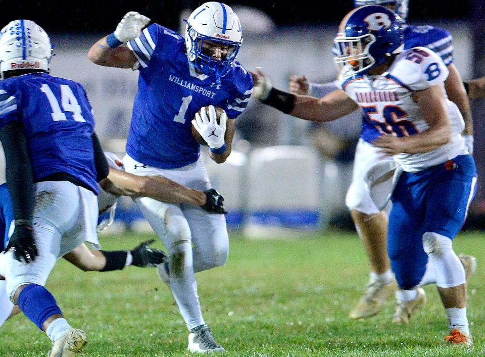 Williamsport's Cole Rourke brakes a tackle before being stopped by Boonsboro's defense during the first half of Friday night's game at Williamsport.