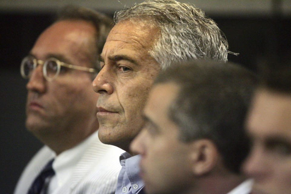 FILE - In this July 30, 2008, file photo, Jeffrey Epstein, center, appears in court in West Palm Beach, Fla. Federal prosecutors, preparing for a bail fight Monday, July 15, 2019, say evidence against Epstein is growing “stronger by the day” after several more women contacted them in recent days to say he abused them when they were underage. (Uma Sanghvi/Palm Beach Post via AP, File)