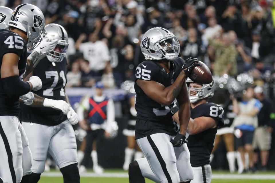 Las Vegas Raiders running back Zamir White (35) celebrates after scoring a touchdown against the Los Angeles Chargers during the first half of an NFL football game, Thursday, Dec. 14, 2023, in Las Vegas. (AP Photo/Steve Marcus)