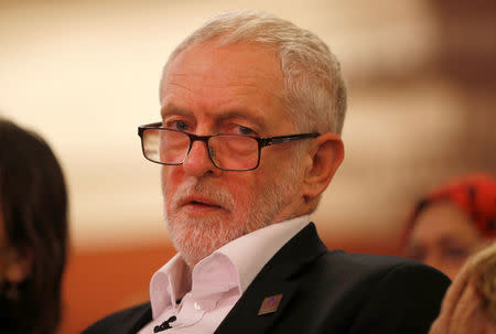 FILE PHOTO: Britain's opposition Labour Party leader, Jeremy Corbyn, listens to Jonathan Ashworth, Shadow Health Secretary, speak at a rally in central London, Britain January 25, 2018. REUTERS/Peter Nicholls/File Photo