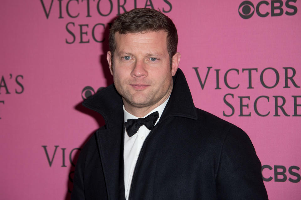 Dermot O'Leary poses for photographers upon arrival at the Victoria's Secret fashion show in London, Tuesday, Dec. 2, 2014. (Photo by Jonathan Short/Invision/AP)