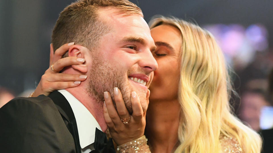 Tom Mitchell is embraced by partner Hannah Davis upon winning the Brownlow. Pic: Getty