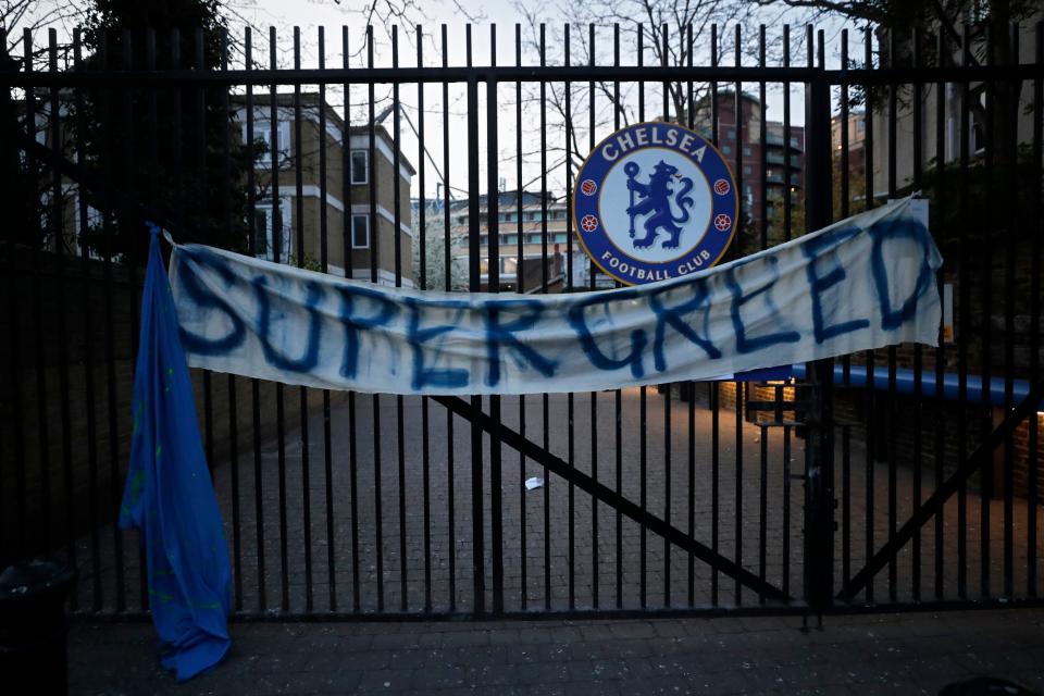 A banner hangs from one of the gates of Stamford Bridge stadium in London where Chelsea fans were protesting the proposed European Super League.