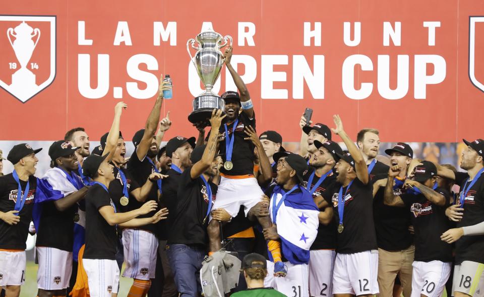 Houston Dynamo players celebrate after the U.S. Open Cup championship soccer match against the Philadelphia Union Wednesday, Sept. 26, 2018, in Houston. Houston Dynamo won 3-0. (AP Photo/David J. Phillip)