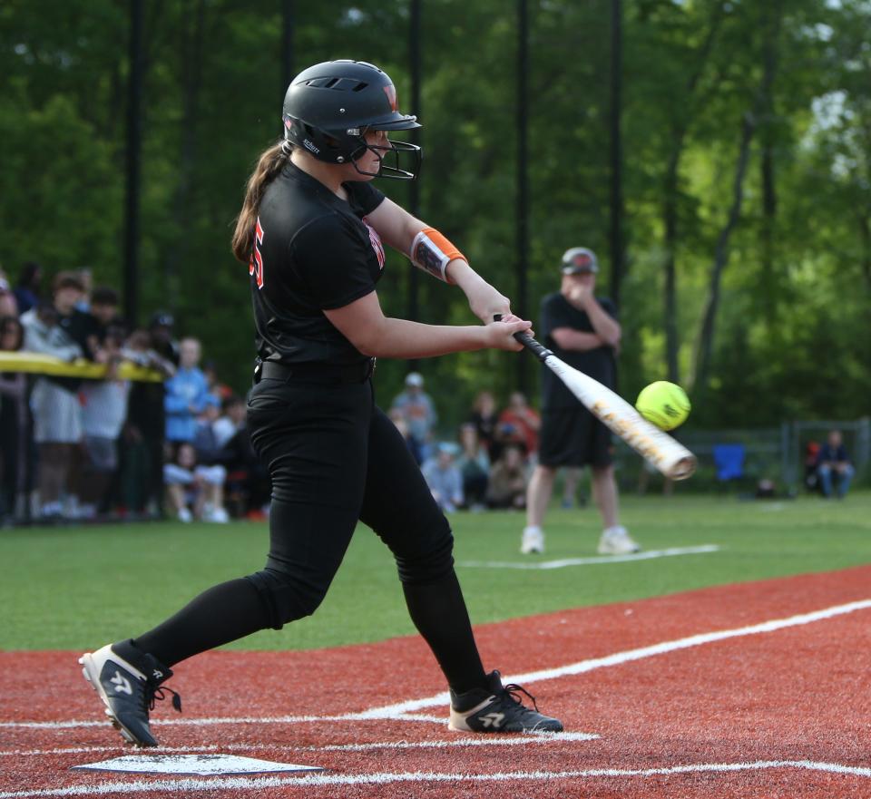 White Plains' Alexa Tighe makes contact on a pitch against Arlington during a Section 1 Class AA softball semifinal on May 24, 2022.