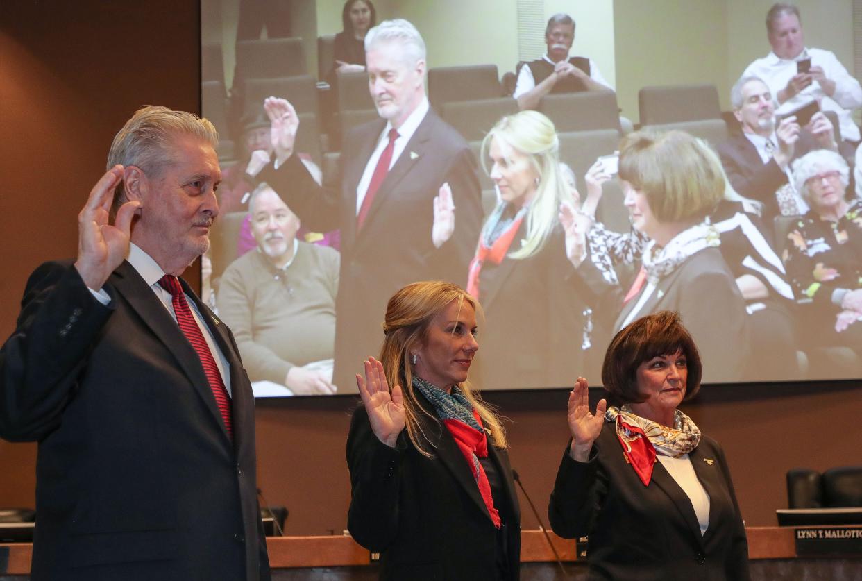 From left, Steve Downs, Meg Marker and Lynn Mallotto are sworn in to the Rancho Mirage City Council during a ceremony Thursday at city hall.