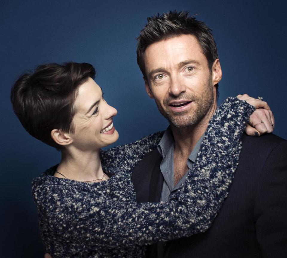 This Dec. 2, 2012 photo shows actors Anne Hathaway, left, and Hugh Jackman in New York. Hathaway portrays Fantine and Jackman portrays Jean Valjean in the film adaptation of the Victor Hugo novel, "Les Miserables." The film opens on Christmas Day. (Photo by Victoria Will/Invision/AP)