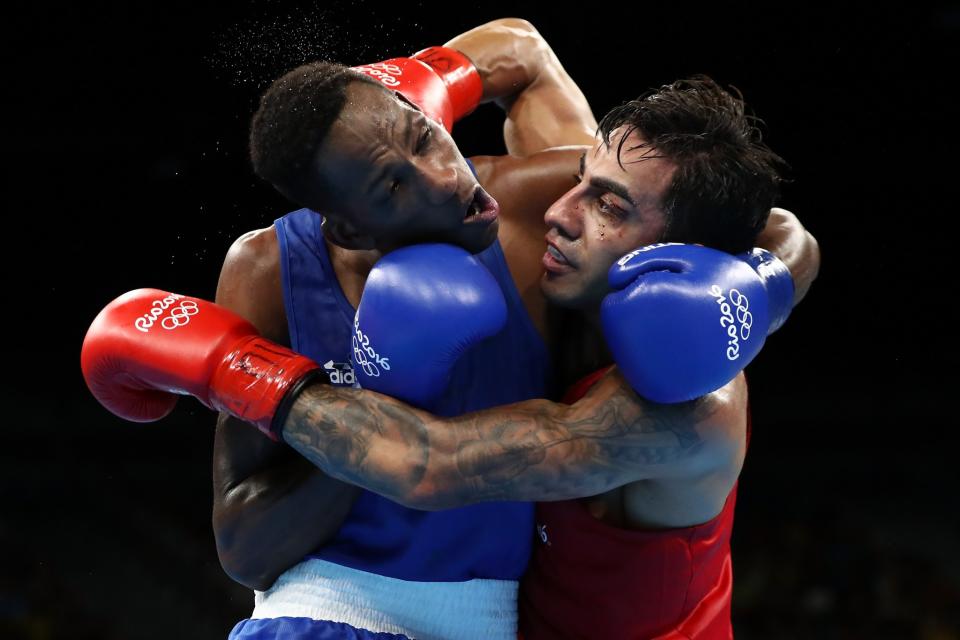 <p>Artem Harutyunyan of Germany fights Lorenzo Sotomayor Collazo of Azerbaijan in the Men’s Light Welter 64kg Semifinal 2 on Day 14 of the Rio 2016 Olympic Games at the Riocentro arena on August 19, 2016 in Rio de Janeiro, Brazil. (Photo by Sean M. Haffey/Getty Images) </p>