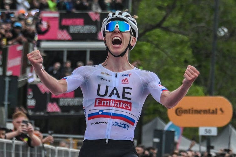 Man celebrates in UAE cycling jersey