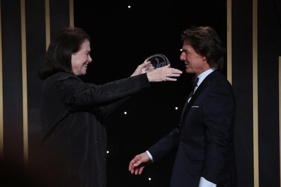 Sherri Lansing, left, and Tom Cruise on stage at the 34th Annual Producers Guild Awards at the Beverly Hilton.