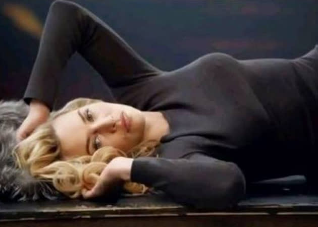 Celebrity advertising campaigns: Kate Winslet may be modeling St John knitwear but all we’re really concerned with is how smoking hot she looks in this suggestive position.