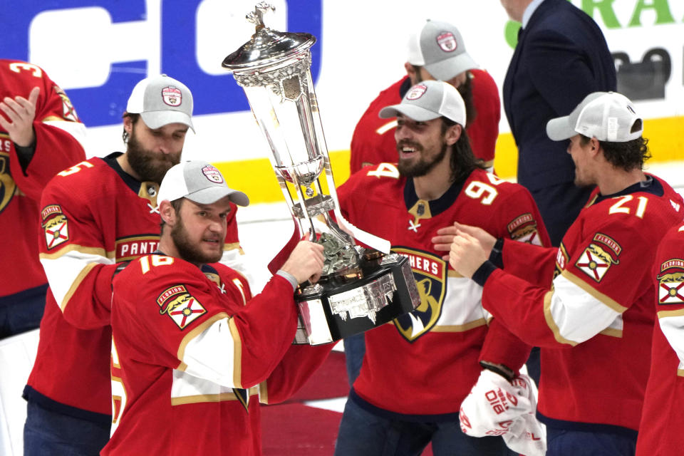 Florida Panthers center Aleksander Barkov holds the Prince of Wales trophy after the Panthers won Game 4 of the NHL hockey Stanley Cup Eastern Conference finals against the Carolina Hurricanes, Wednesday, May 24, 2023, in Sunrise, Fla. (AP Photo/Lynne Sladky)