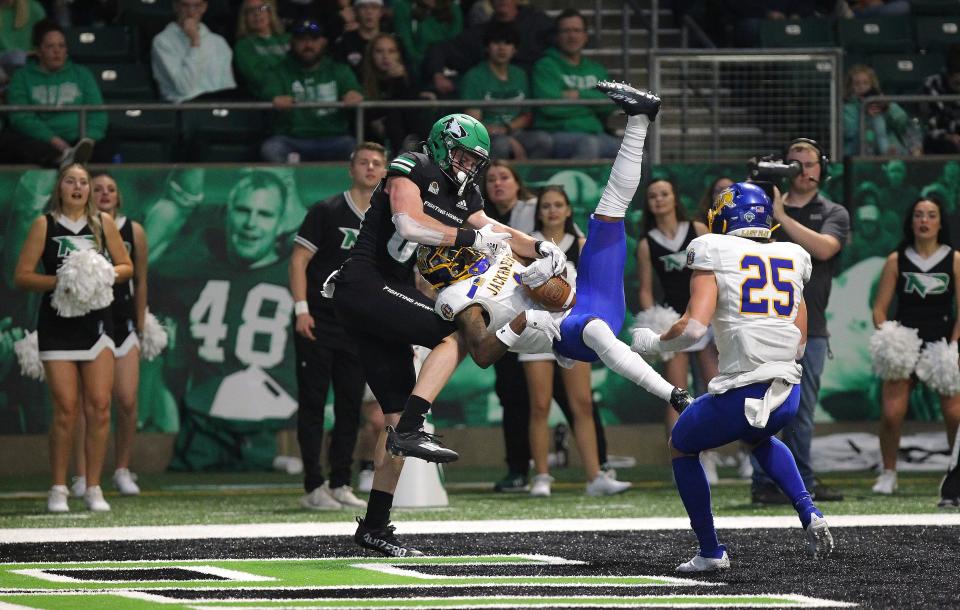 S.D. State cornerback Malik Lofton (1) intercepts a pass intended for UND wide receiver Garett Maag (89) late in the second quarter of a Missouri Valley Football Conferce game at the Alerus Center in Grand Forks on Saturday, October 22, 2022.