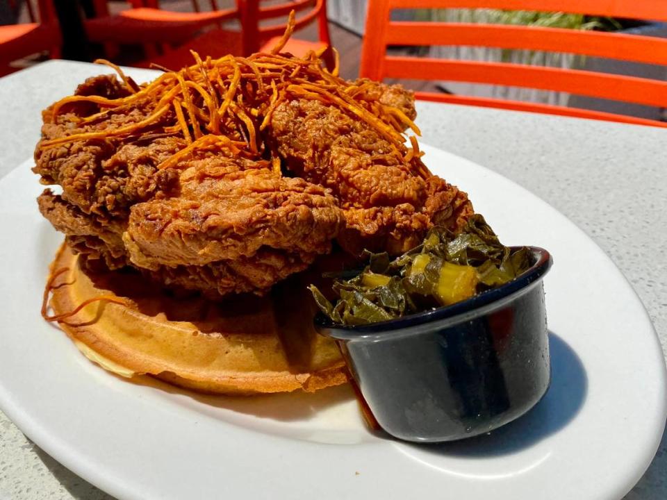 Chicken and waffles with greens at the Rim in the Waterside shopping center.