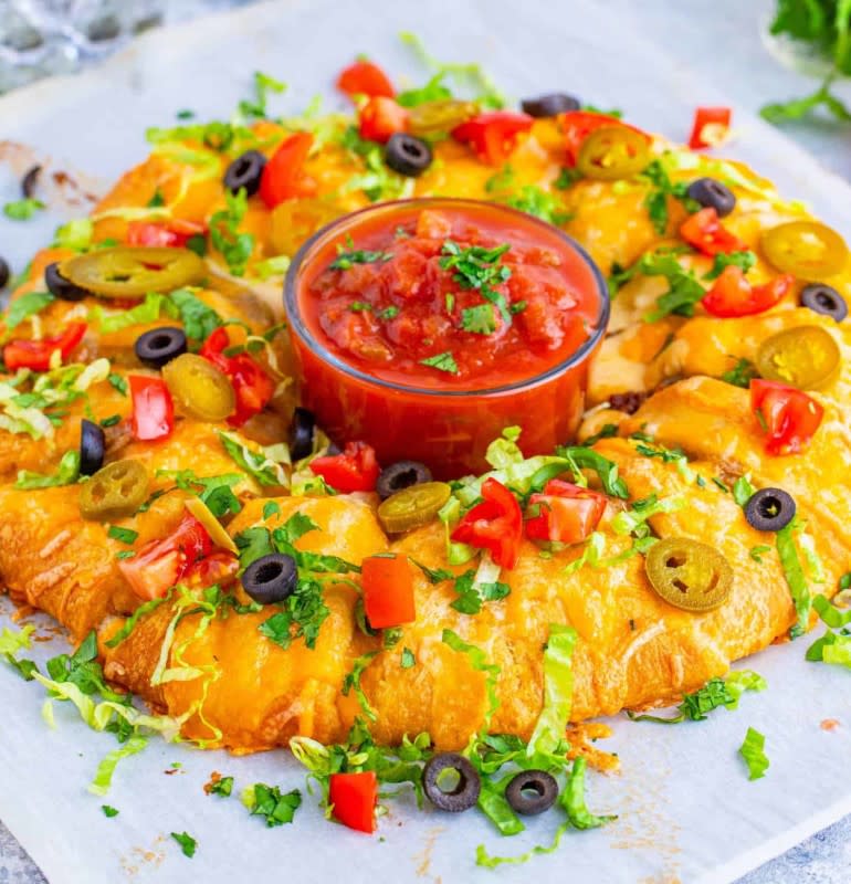 <p>The Country Cook</p><p>This fun dish is perfect for a party or a simple weeknight supper.</p><p><strong>Get the recipe: <a href="https://www.thecountrycook.net/taco-crescent-ring/" rel="nofollow noopener" target="_blank" data-ylk="slk:Taco Crescent Ring;elm:context_link;itc:0;sec:content-canvas" class="link ">Taco Crescent Ring</a></strong></p>