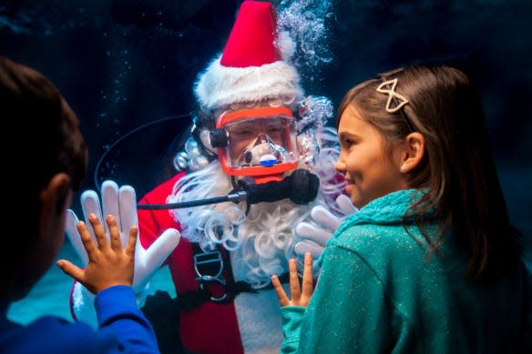 Kids can visit with Scuba Santa at Newport Aquarium through Dec. 24.