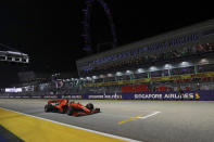 Ferrari driver Sebastian Vettel of Germany steers his car on the way to win the Singapore Formula One Grand Prix, at the Marina Bay City Circuit in Singapore, Sunday, Sept. 22, 2019. (AP Photo/Lim Yong Teck)