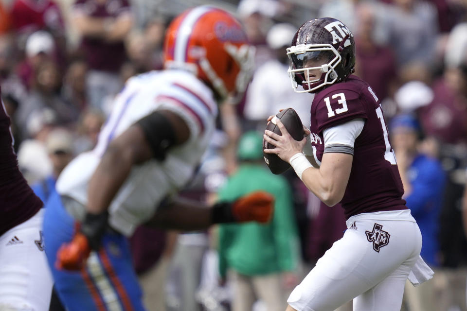 Texas A&M quarterback Haynes King (13) looks to pass down field against Florida during the second quarter of an NCAA college football game Saturday, Nov. 5, 2022, in College Station, Texas. (AP Photo/Sam Craft)