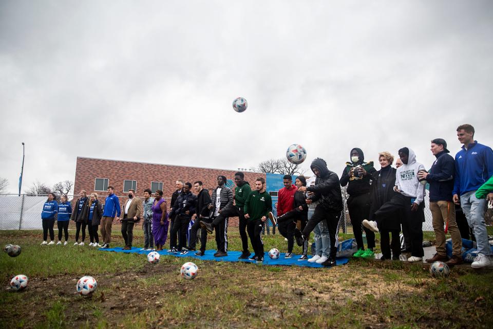 Representatives of Des Moines Public Schools and Drake University gather in April for a kick-off ceremony at the site of the Des Moines Public Schools Community Stadium on Drake's campus in Des Moines.