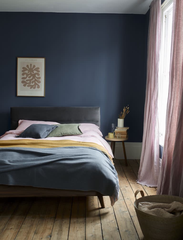 <p>While pink and grey are a match made in heaven, it doesn't mean you can't play around with other colours. Navy blue, as seen here for example, creates a cocooning effect in the bedroom. Keep your accessories pretty in pink, opt for a grey bed frame, and then bring in a stark contrast with deep blue walls. </p><p>• Maisy ottoman bed frame, <a href="https://www.dreams.co.uk/maisy-upholstered-ottoman-bed-frame/p/251-00384" rel="nofollow noopener" target="_blank" data-ylk="slk:House Beautiful collection at Dreams;elm:context_link;itc:0;sec:content-canvas" class="link ">House Beautiful collection at Dreams</a></p>