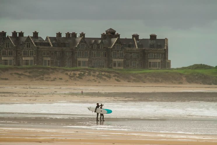 Surfers look at waves at Doughmore Beach in front of Trump International Golf Course in Doonbeg, Ireland. (Lauren Parrino/STWC)