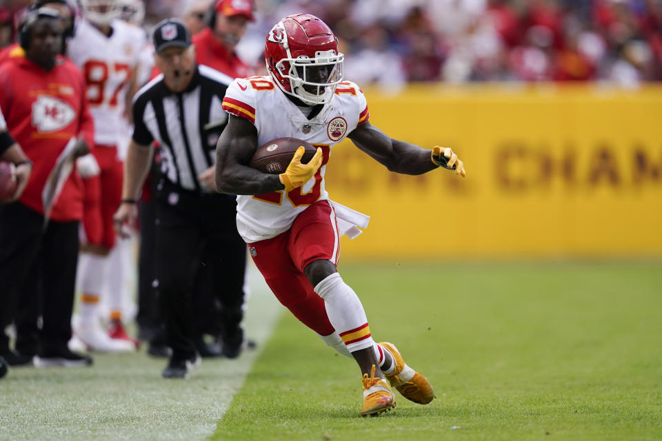 Kansas City Chiefs wide receiver Tyreek Hill (10) running with the ball during the second half of an NFL football game against the Washington Football Team, Sunday, Oct. 17, 2021, in Landover, Md. (AP Photo/Mark Tenally)