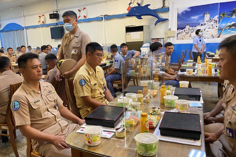 Taiwan navy sailors sit with partitions on the dining tables, part of coronavirus (COVID-19) pandemic prevention measures, before Taiwan's President Tsai Ing-wen arrives for lunch with them, at the Zuoying naval base in Kaohsiung, Taiwan
