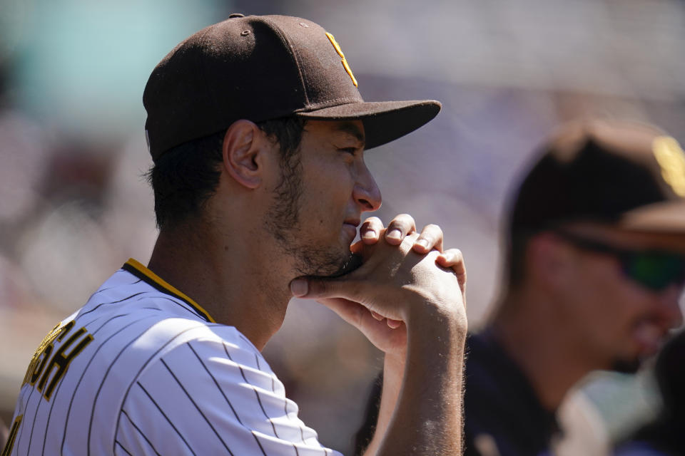San Diego Padres starting pitcher Yu Darvish looks on in the dugout during the seventh inning of the first baseball game of a doubleheader against the Colorado Rockies, Tuesday, Aug. 2, 2022, in San Diego. (AP Photo/Gregory Bull)