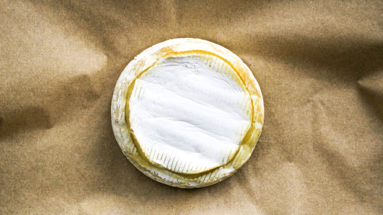 brie cheese wheel on parchment paper